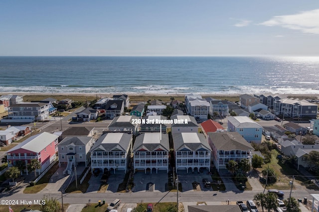 bird's eye view featuring a beach view and a water view