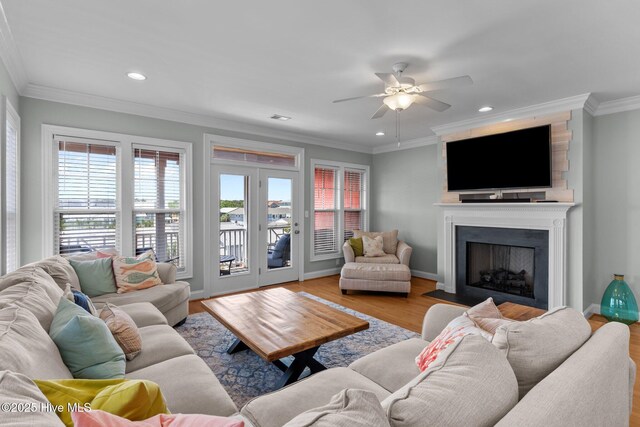 230 Third Ave Unit A, Kure Beach, NC 28449 - living area with a ceiling fan, a large fireplace, wood finished floors, recessed lighting, and ornamental molding