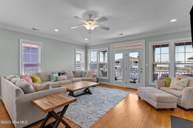 230 Third Ave Unit A, Kure Beach, NC 28449 - living area with plenty of natural light, light wood-style floors, ornamental molding, ceiling fan, and recessed lighting