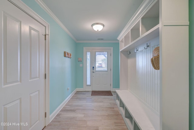 mudroom with light hardwood / wood-style flooring and crown molding