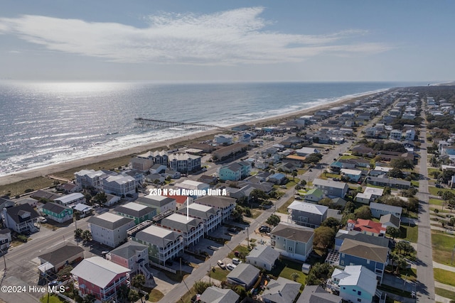 bird's eye view featuring a beach view and a water view