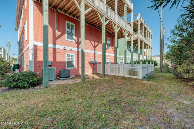 230 Third Ave Unit A, Kure Beach, NC 28449 - rear view of property featuring central AC unit