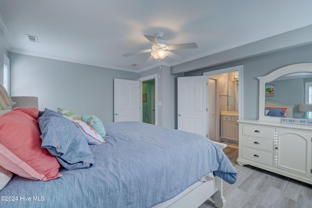 bedroom with light hardwood / wood-style flooring, ensuite bathroom, ceiling fan, and crown molding