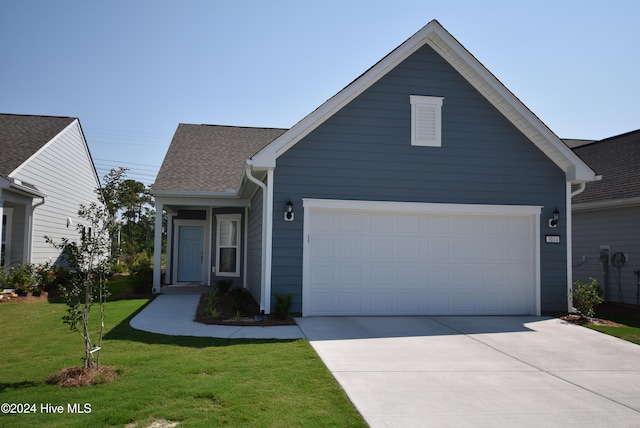 view of front facade featuring a garage and a front yard