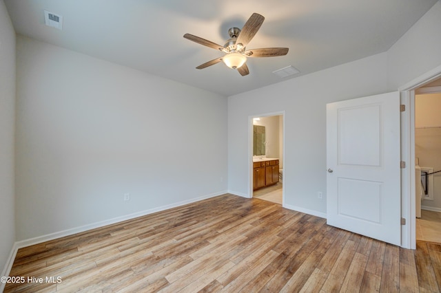 unfurnished bedroom featuring ensuite bathroom, ceiling fan, and light hardwood / wood-style floors