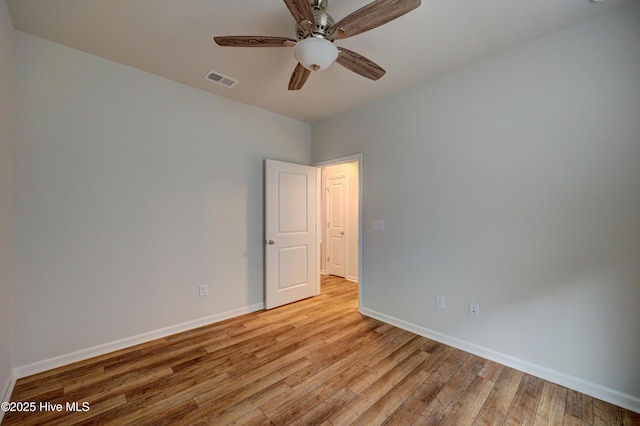 spare room featuring ceiling fan and light hardwood / wood-style flooring