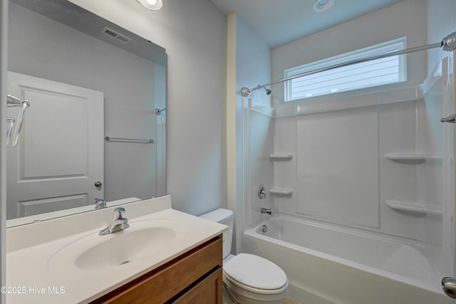 full bathroom with vanity,  shower combination, and toilet