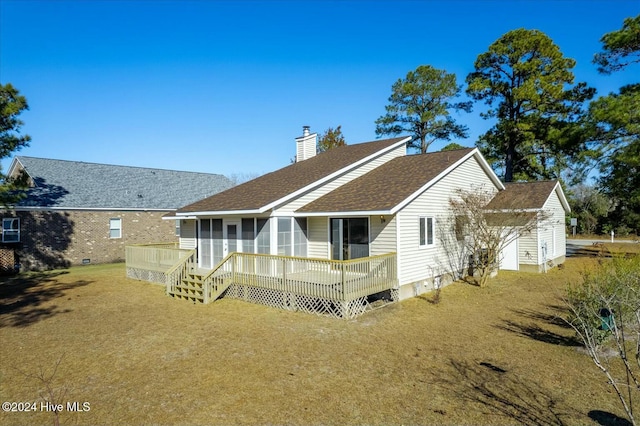 back of house featuring a deck and a sunroom