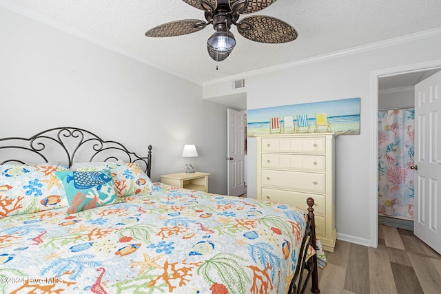 bedroom with a textured ceiling, light hardwood / wood-style flooring, ceiling fan, and crown molding