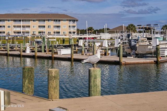 view of dock featuring boat lift and a water view