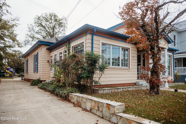 view of property exterior with a porch