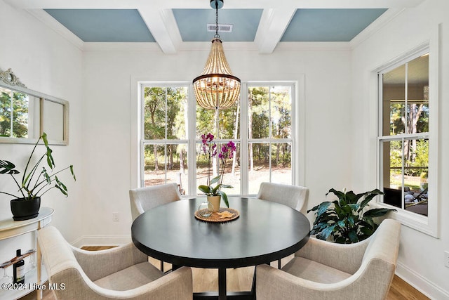 dining space featuring plenty of natural light, beamed ceiling, wood-type flooring, and an inviting chandelier