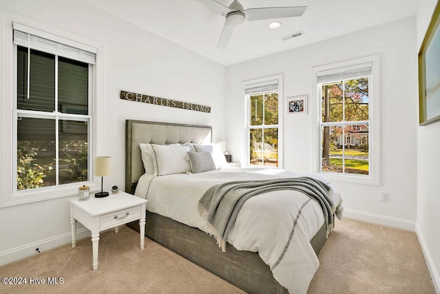 carpeted bedroom with ceiling fan