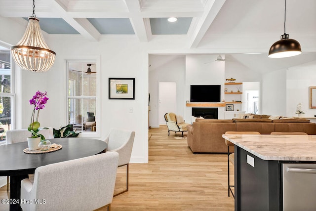 dining area with coffered ceiling, beam ceiling, light wood-type flooring, and an inviting chandelier