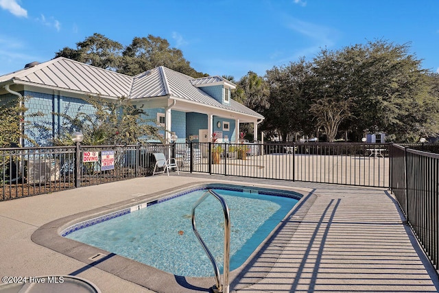 view of pool with a patio area