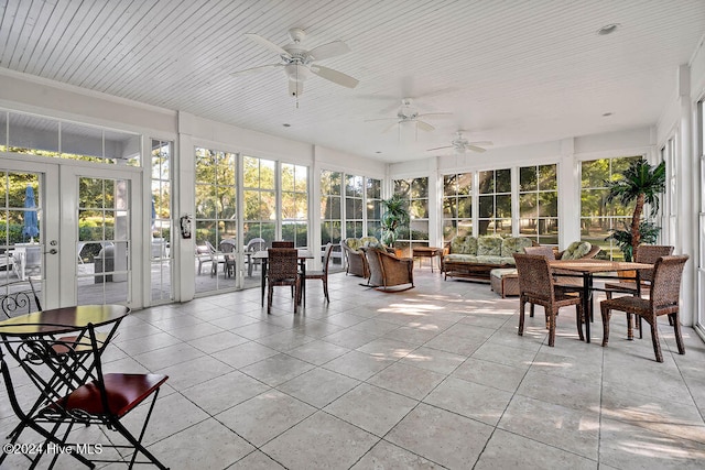 sunroom with ceiling fan, wooden ceiling, and french doors