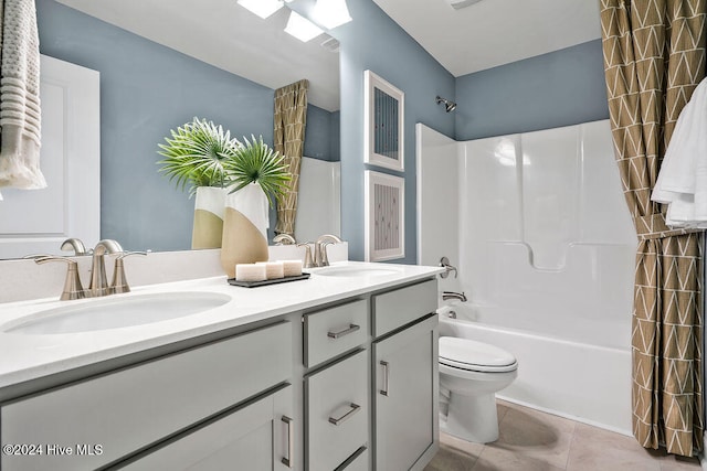 full bathroom with tile patterned flooring, vanity, toilet, and shower / tub combo