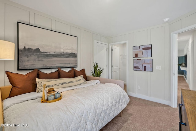 bedroom with light carpet