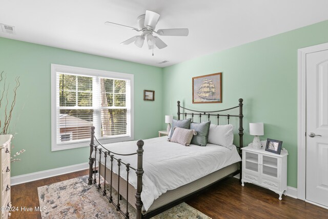 bedroom featuring ceiling fan and dark hardwood / wood-style floors