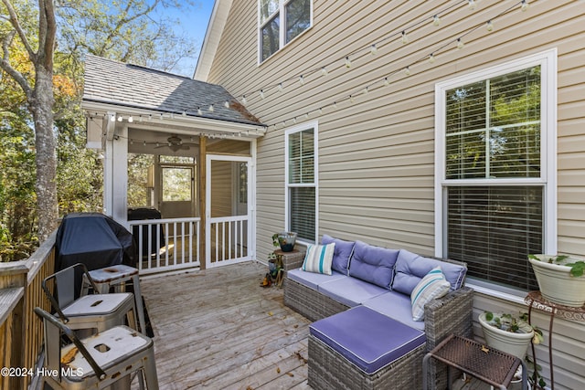 wooden terrace with outdoor lounge area, ceiling fan, and grilling area