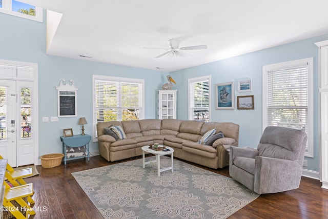 living room with ceiling fan and dark hardwood / wood-style floors