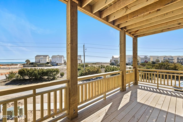 wooden terrace featuring a residential view