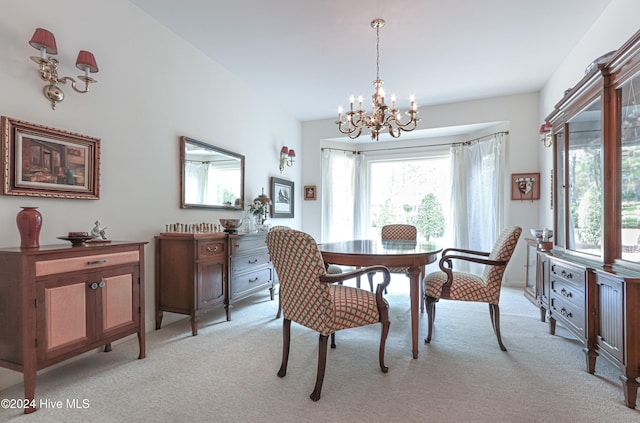 carpeted dining space with a notable chandelier