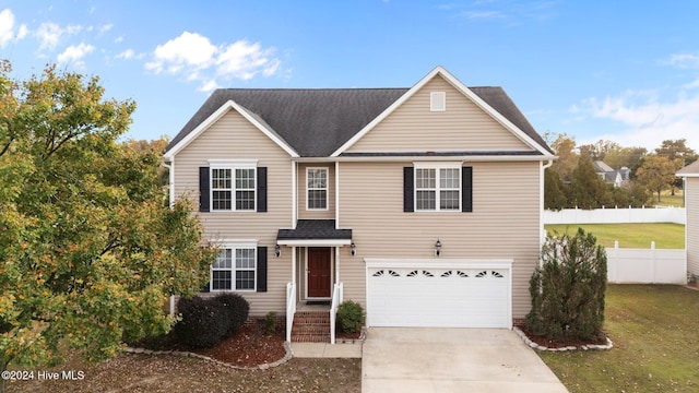 front facade featuring a garage and a front lawn