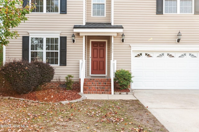 property entrance with a garage