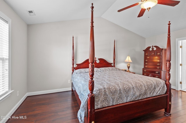 bedroom featuring vaulted ceiling, ceiling fan, and dark hardwood / wood-style flooring