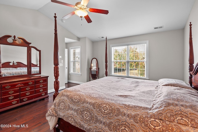 bedroom with vaulted ceiling, ceiling fan, and dark hardwood / wood-style flooring