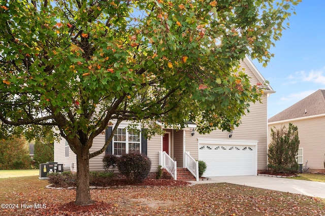 obstructed view of property with a garage