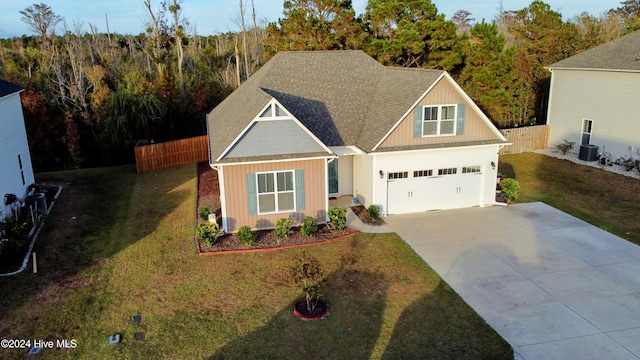 view of front of property with a front yard and a garage