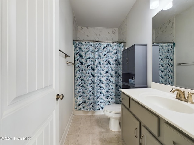 bathroom featuring tile patterned floors, vanity, a shower with shower curtain, and toilet