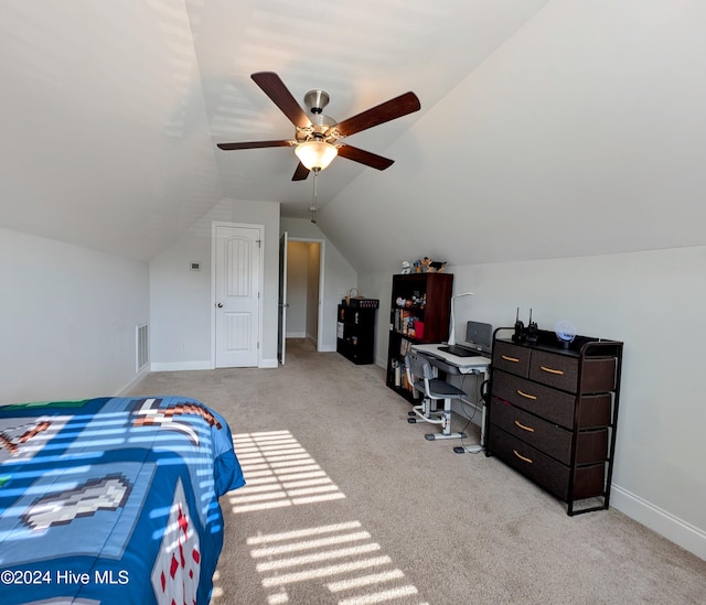 bedroom with ceiling fan, light carpet, and vaulted ceiling