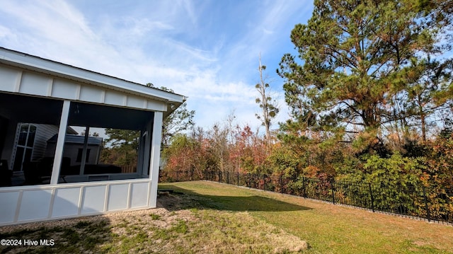 view of yard featuring a sunroom