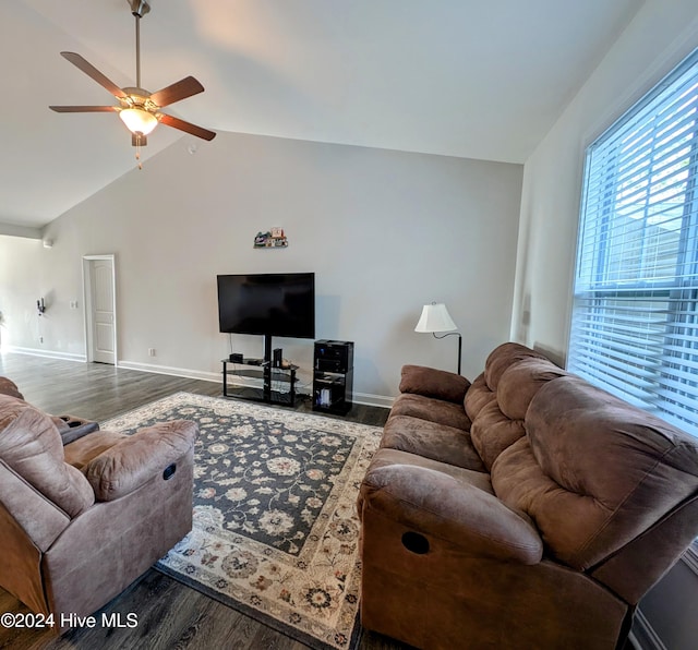 living room with ceiling fan, dark wood-type flooring, and lofted ceiling