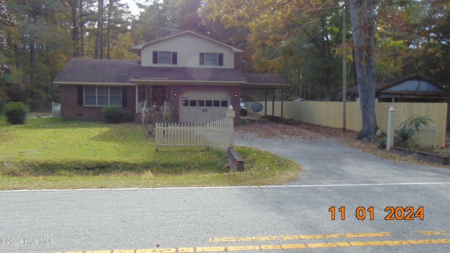 front of property with a garage and a front yard