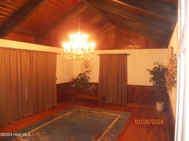 interior space featuring vaulted ceiling with beams, wood ceiling, an inviting chandelier, hardwood / wood-style flooring, and wooden walls