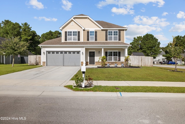 craftsman-style house featuring a porch, a front lawn, and a garage