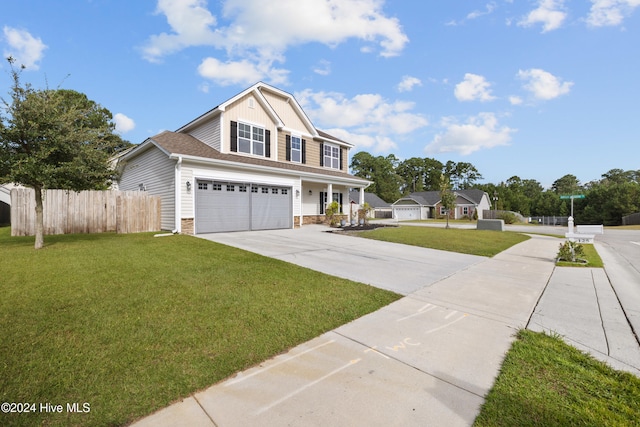 view of front property with a garage and a front lawn