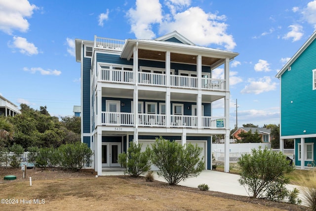 view of front of property featuring a garage and french doors