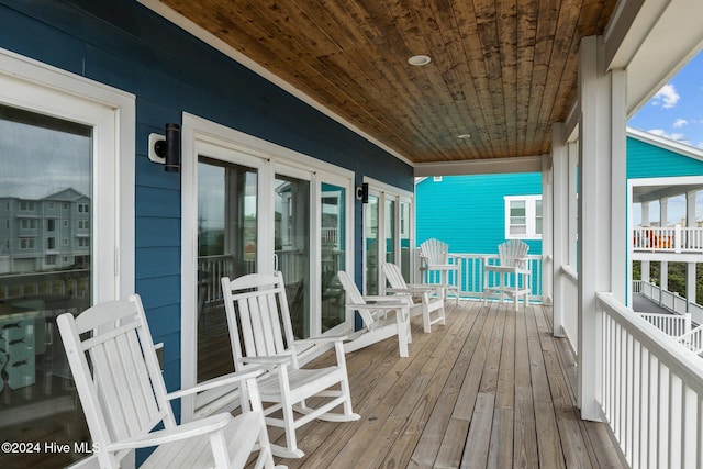 wooden deck featuring covered porch