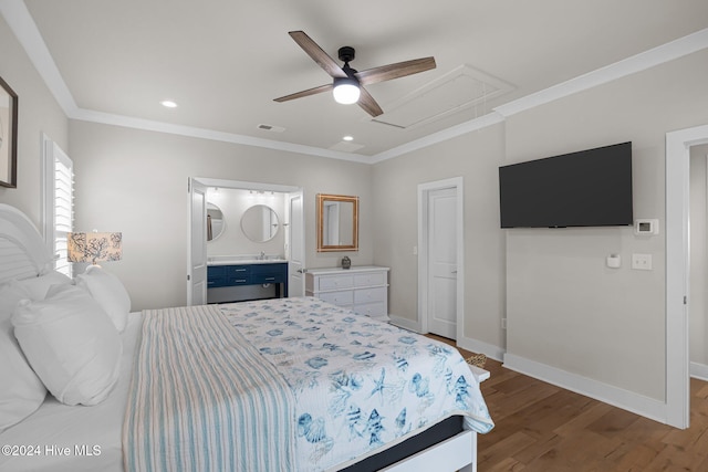 bedroom featuring hardwood / wood-style flooring, ceiling fan, connected bathroom, and crown molding