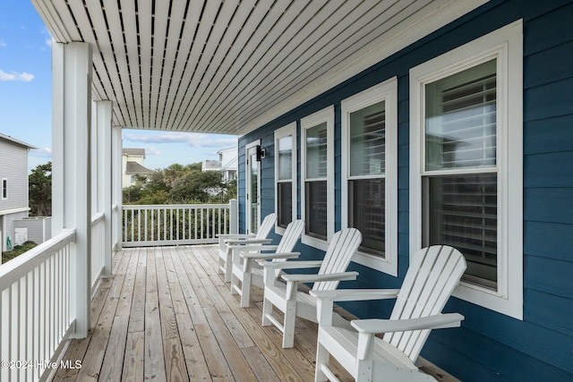 wooden terrace featuring a porch