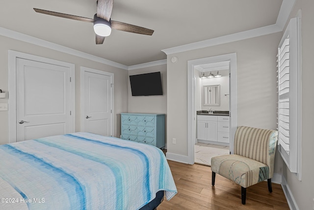 bedroom with ornamental molding, ensuite bath, ceiling fan, and light hardwood / wood-style flooring