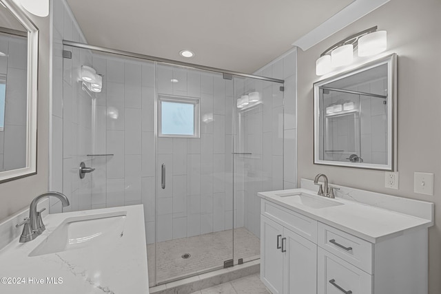 bathroom with an enclosed shower and vanity