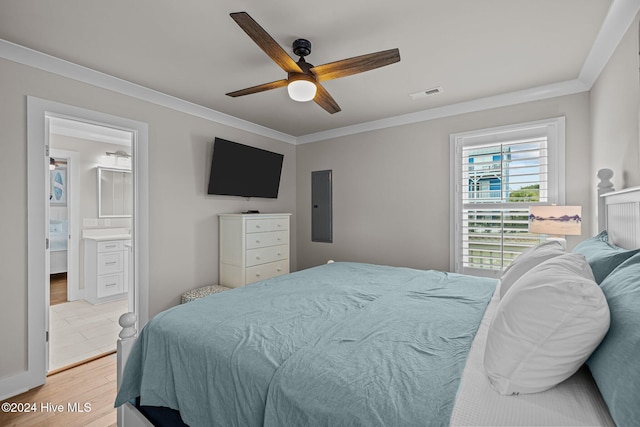 bedroom with ceiling fan, crown molding, light hardwood / wood-style floors, and ensuite bathroom