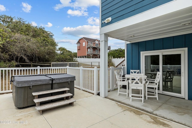 view of patio / terrace featuring a hot tub