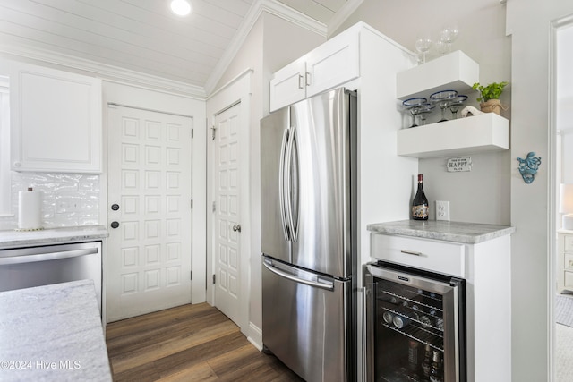 kitchen featuring stainless steel appliances, white cabinetry, beverage cooler, lofted ceiling, and dark wood-type flooring